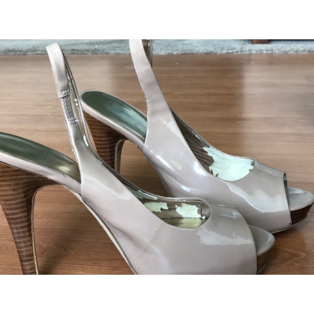 Beige colored high heels.